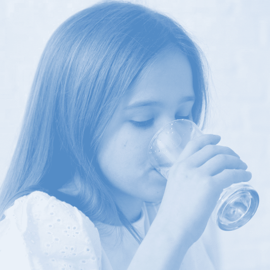 Girl drinking water filtered by ProOne gravity water filter