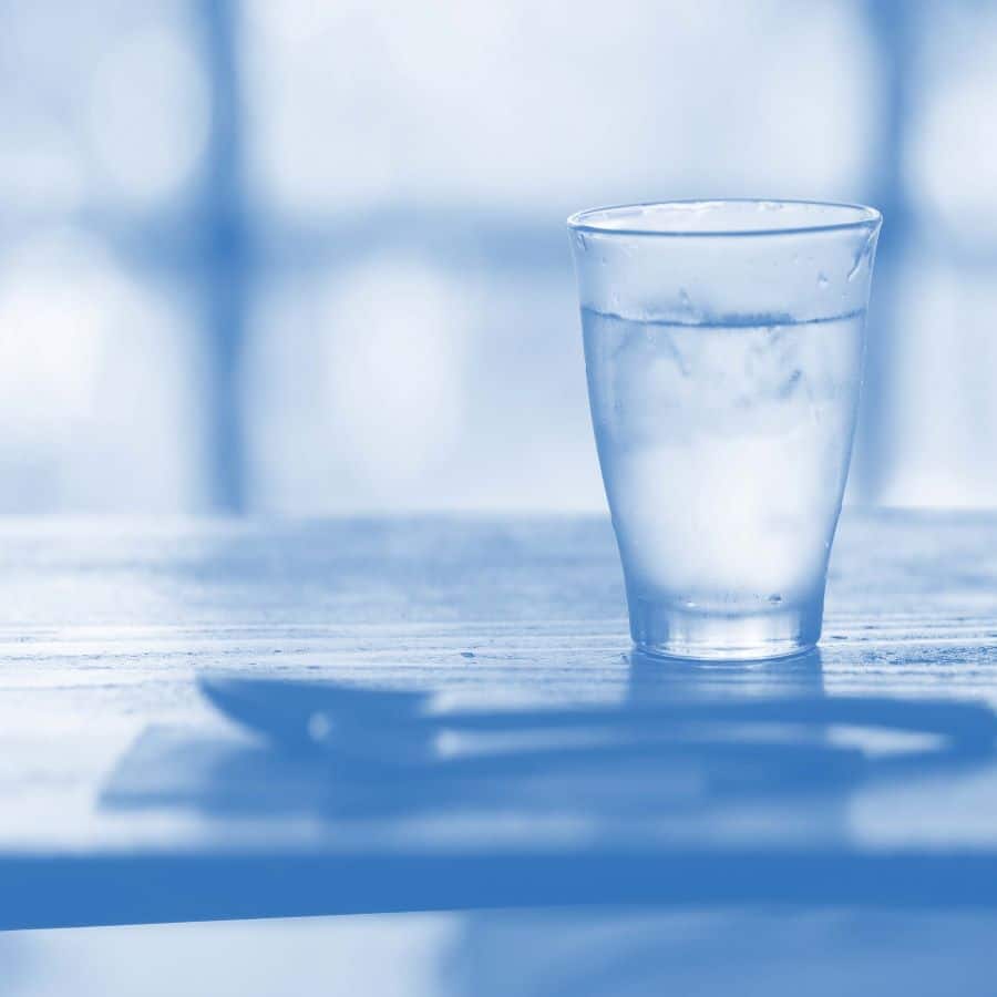 A glass of water on a table