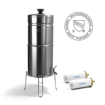 Stainless steel water filter with two replacement filters on a white background
