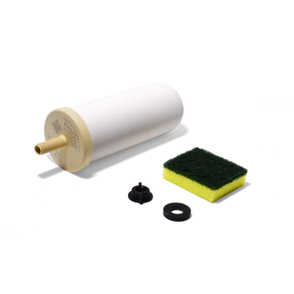 Filter cartridge, sponge, and washers on a white background